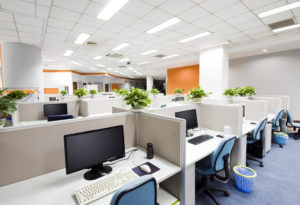 Cubicles and desks with computers in modern office Office