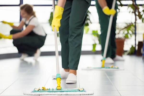 person cleaning floor